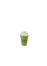 โหลดรูปภาพลงในเครื่องมือใช้ดูของ Gallery signature perfume inspired green matcha drink cup with white whipped cream topping and black text branding
